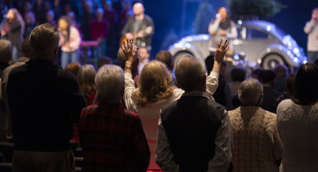 women hands in the air worshiping